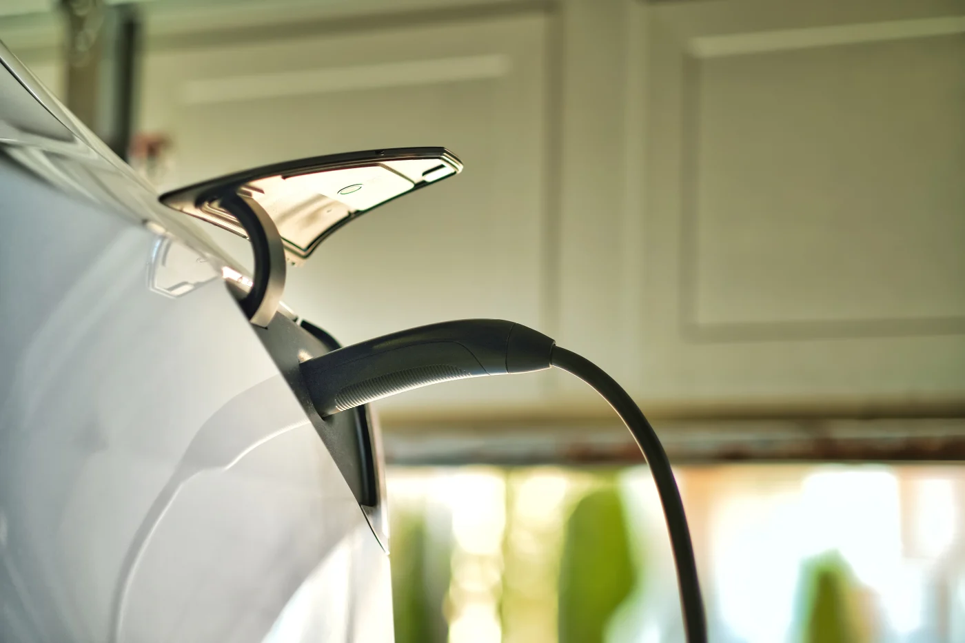 Electric Car Plugged In To Charge At Home