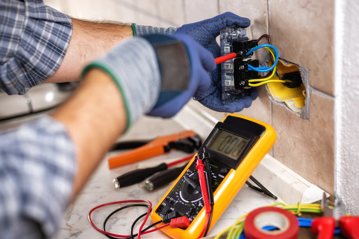 Electrician Checking Outlets In A Home