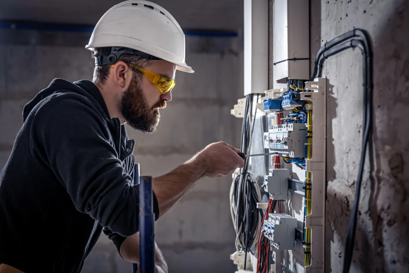 Emerge Electrical electrician at work with safety equipment on a residential electrical system in Olympia, WA.