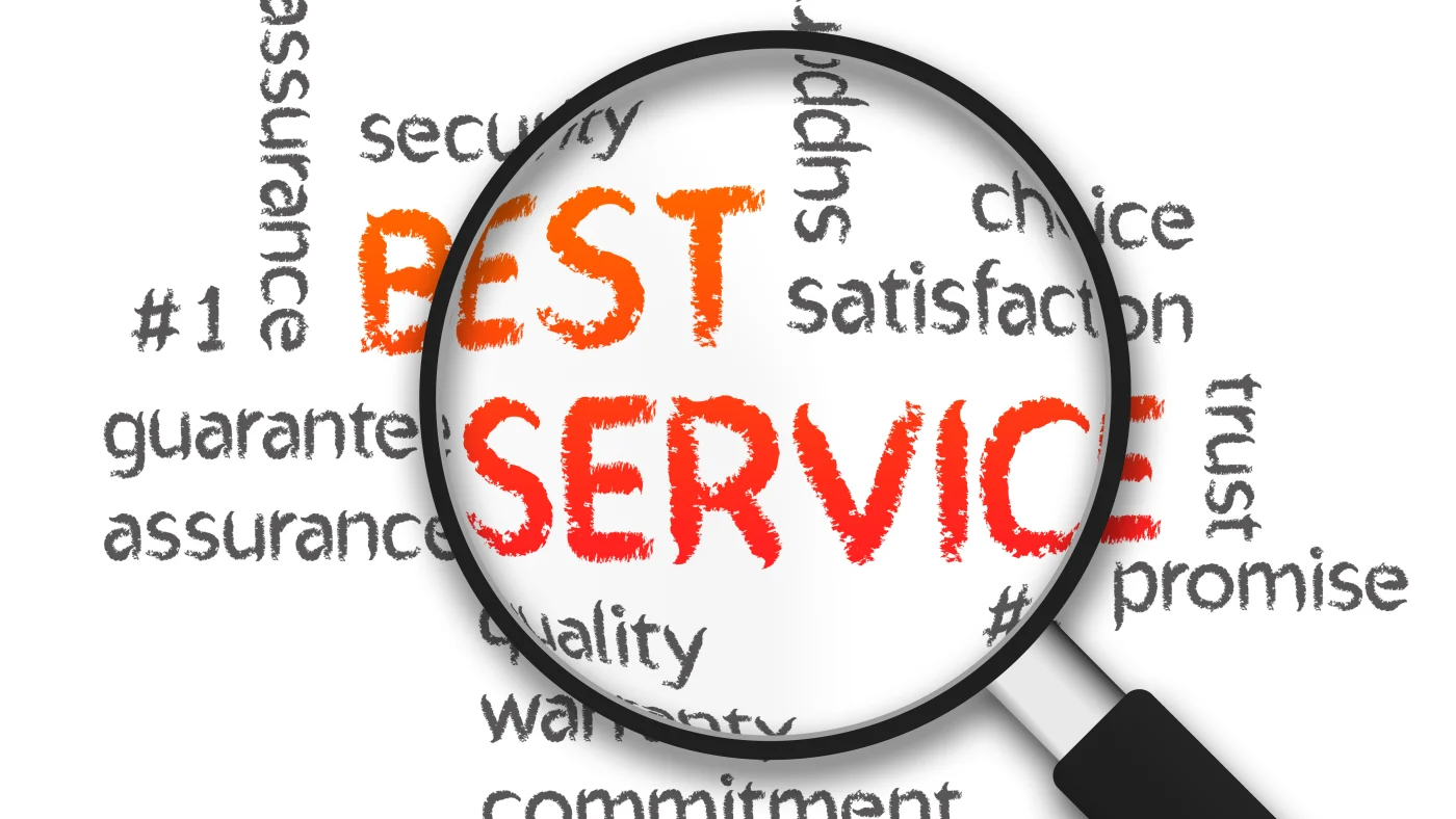 A magnifying glass over the words “Best Service” written in red with supportive keywords written around it in black