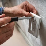 Electrician installing an electrical outlet socket in Tumwater, WA | Emerge Electrical